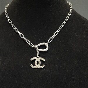 CHANEL Silver with Crystal Component Logo on Gold Plated Chain.